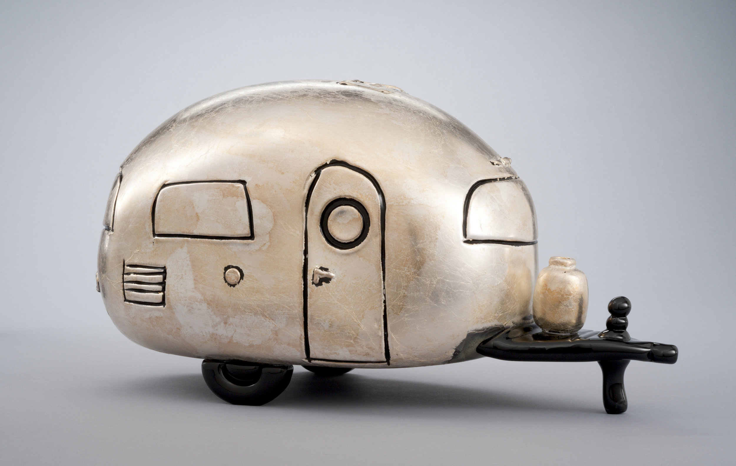  Alex Stisser (American, born 1974).&nbsp; Silver Loaf,  Made at the Museum in 2010.&nbsp;Blown glass and silver foil;&nbsp;8 1/2 x 17 x 7 3/4 in.&nbsp;Collection of Museum of Glass, Tacoma, Washington, gift of the artist.&nbsp;Photo by Duncan Price.